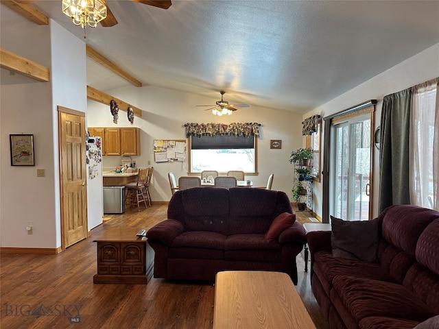 living room with a wealth of natural light, dark wood-type flooring, ceiling fan, and lofted ceiling with beams