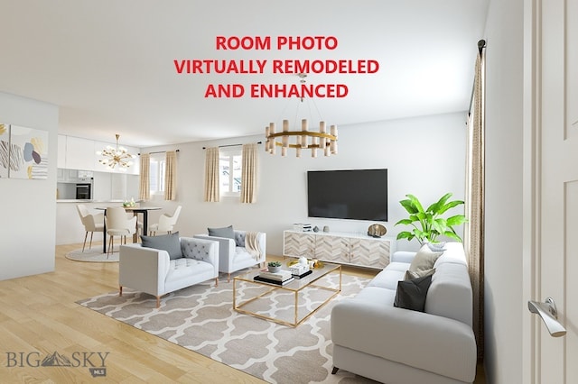 living room with a notable chandelier and light hardwood / wood-style floors