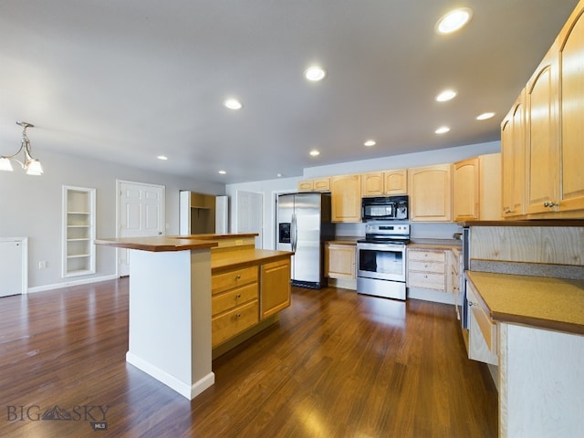 kitchen with dark wood-type flooring, appliances with stainless steel finishes, a notable chandelier, light brown cabinets, and a center island