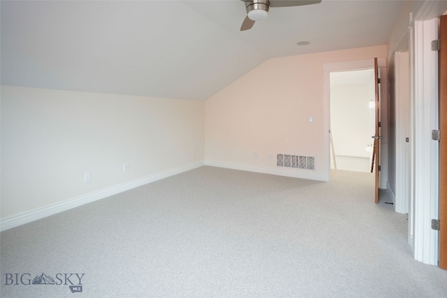 bonus room with ceiling fan, light colored carpet, and vaulted ceiling