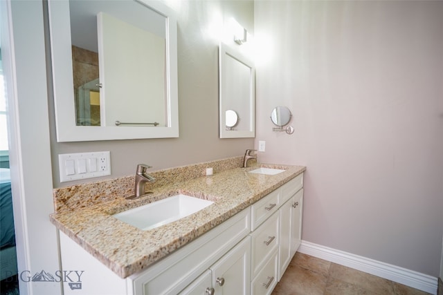 bathroom featuring dual vanity and tile floors