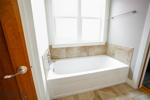 bathroom with tile floors and a bath to relax in