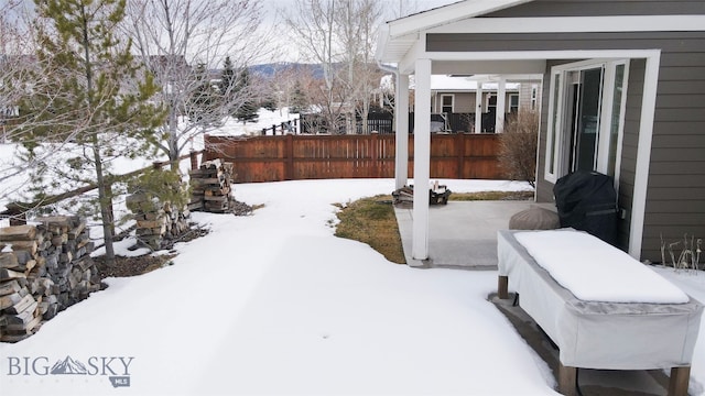 view of snow covered patio