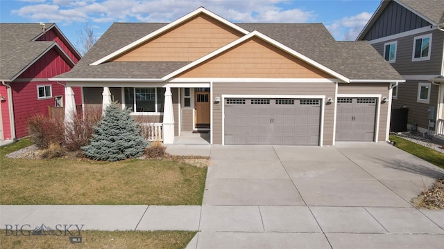 craftsman-style house with a front yard, a porch, and a garage