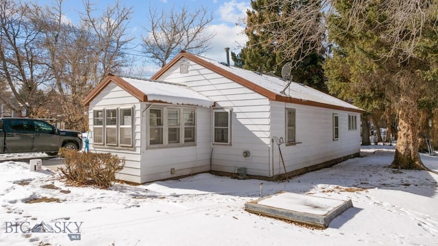 view of snow covered property