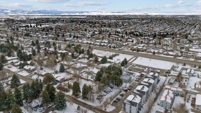 snowy aerial view featuring a residential view