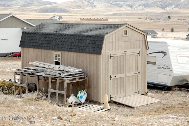 view of outbuilding with a mountain view