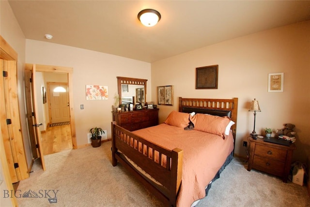 bedroom featuring light colored carpet