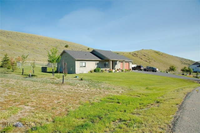 exterior space featuring a mountain view and a garage