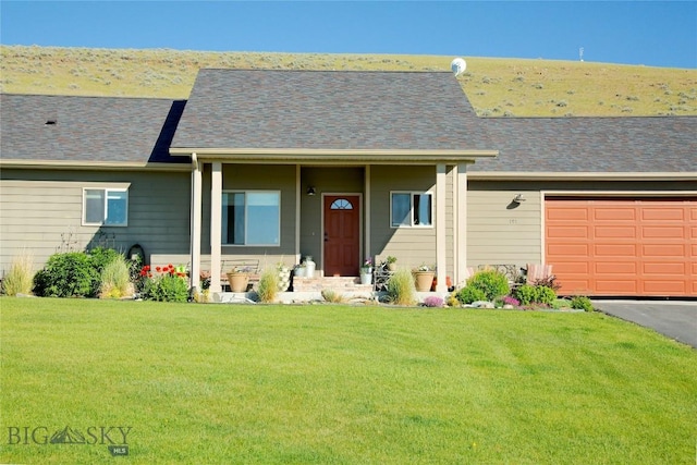 single story home featuring a front yard and a garage