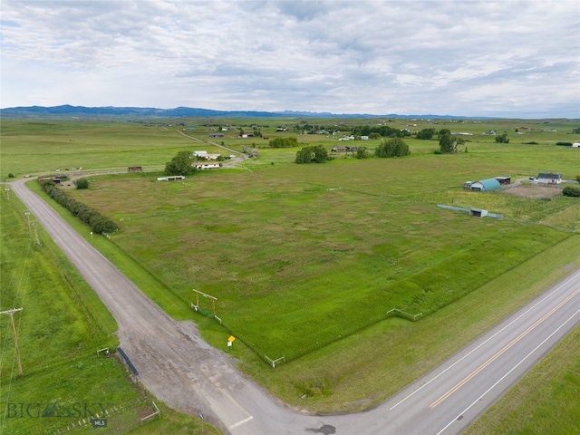 birds eye view of property with a rural view