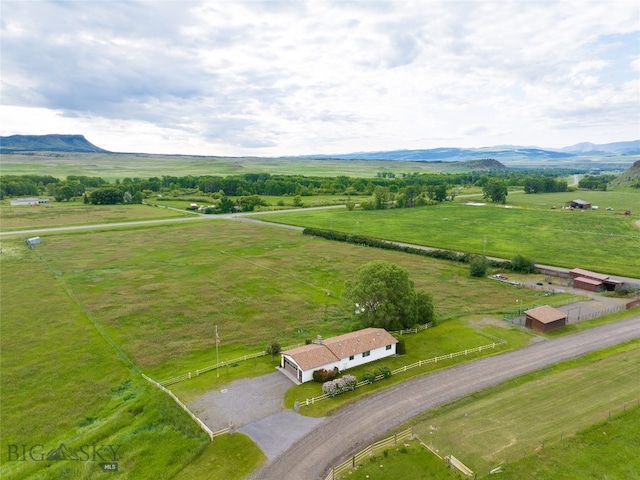 drone / aerial view featuring a mountain view and a rural view