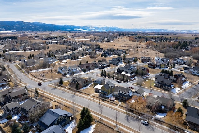 birds eye view of property with a mountain view