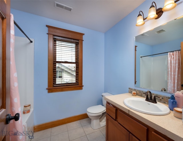 full bathroom with tile patterned floors, shower / bath combination with curtain, vanity, and toilet