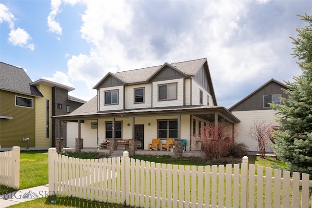 view of front of home with a front yard and covered porch