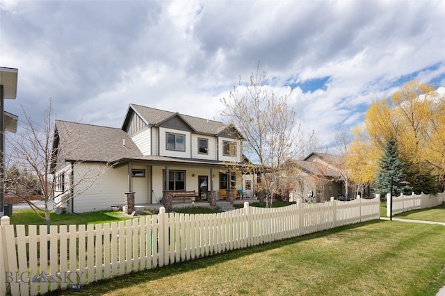 view of front of property with a porch and a front lawn