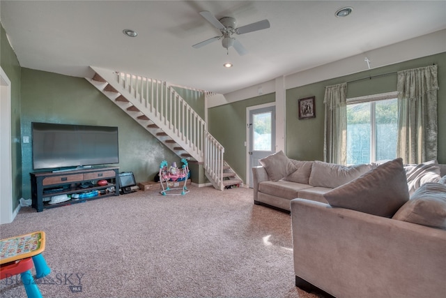 living room featuring ceiling fan and carpet flooring