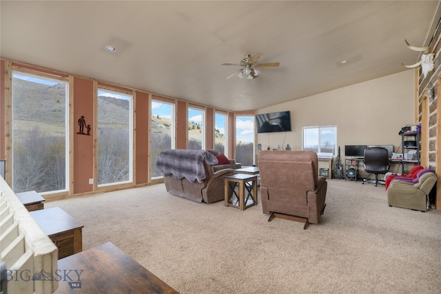 carpeted living room featuring ceiling fan