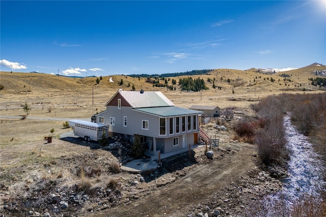 aerial view featuring a mountain view and a rural view