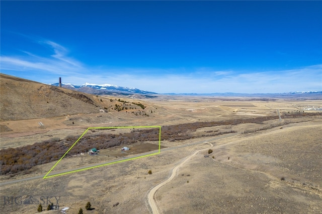 drone / aerial view featuring a mountain view