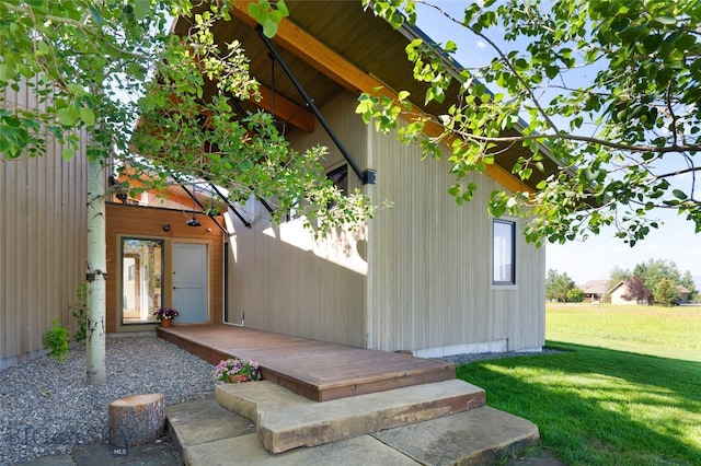 exterior space with french doors and a lawn