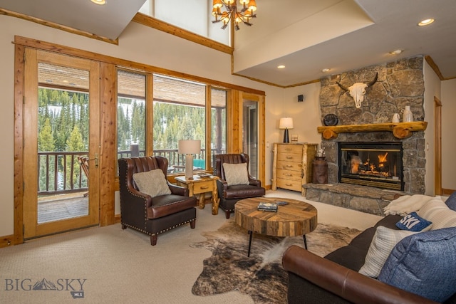 carpeted living room featuring a fireplace and a chandelier