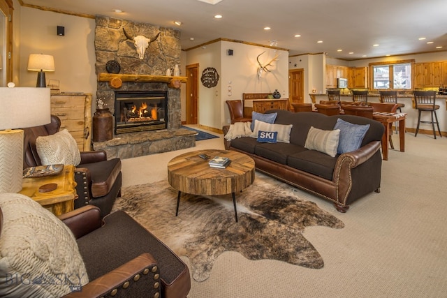 living room with light carpet and a stone fireplace