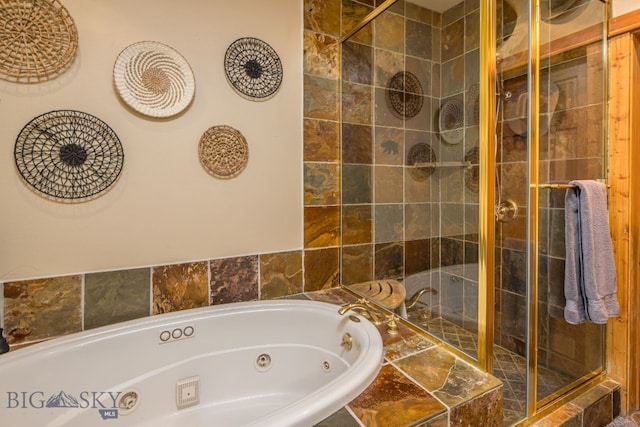 bathroom featuring separate shower and tub