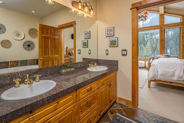 bathroom with double sink, tile floors, and oversized vanity