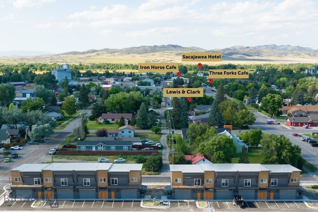 drone / aerial view featuring a residential view and a mountain view