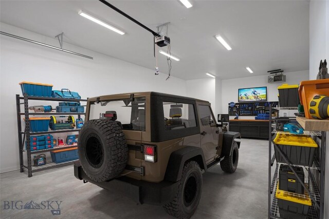 garage featuring a garage door opener