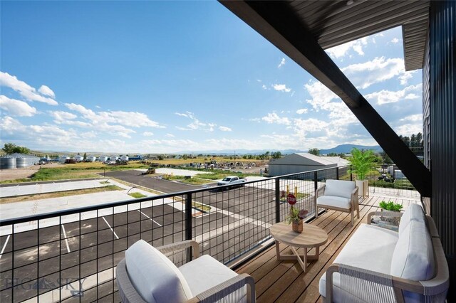 balcony featuring a mountain view