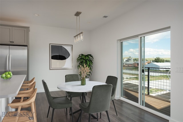 dining area featuring dark hardwood / wood-style floors and a healthy amount of sunlight