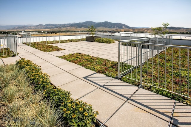 view of terrace with a mountain view