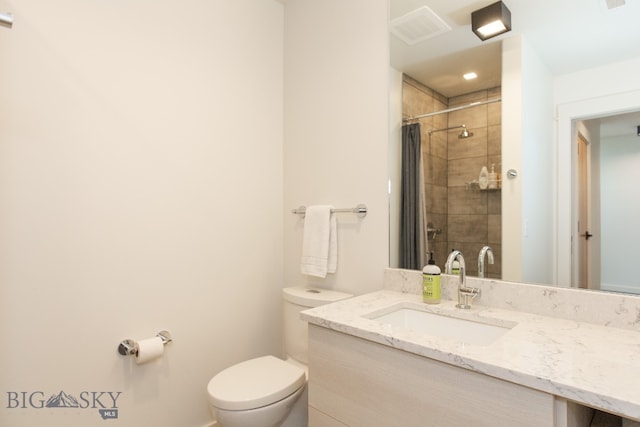 bathroom with oversized vanity and toilet