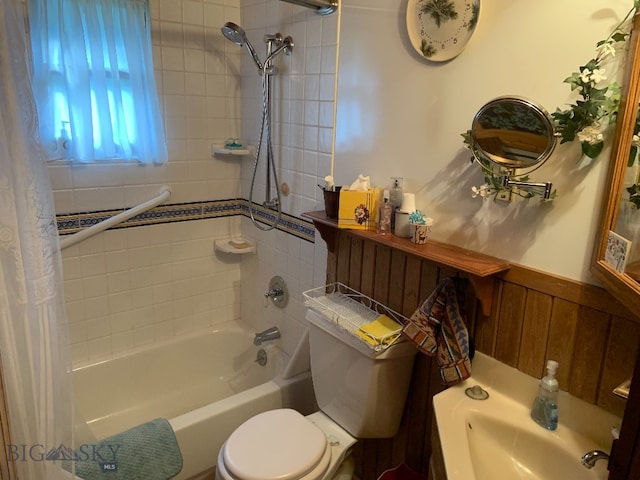 bathroom with shower / bath combo and toilet