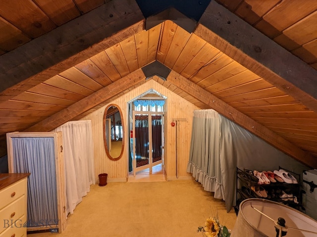 interior space featuring light carpet, wood ceiling, and lofted ceiling