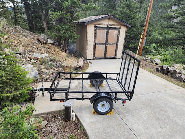 view of terrace featuring a storage shed