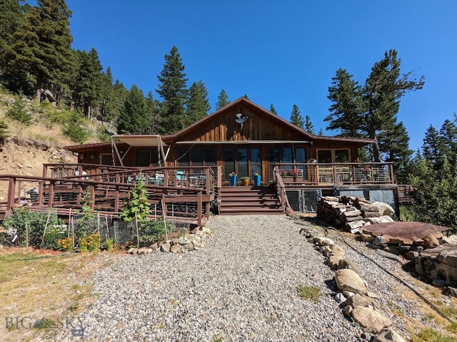 log home featuring a deck