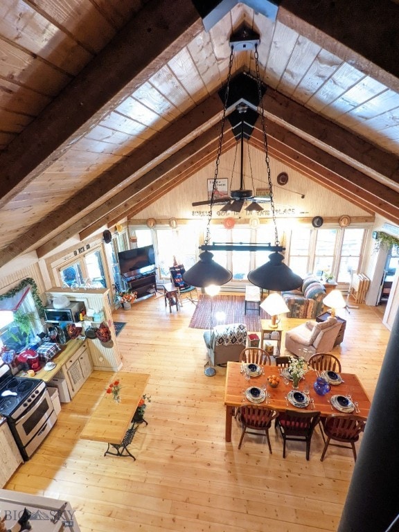 living room featuring hardwood / wood-style flooring, wood ceiling, and vaulted ceiling with beams