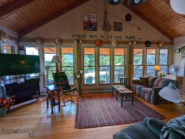 living room with wood-type flooring, a wealth of natural light, wood ceiling, and a baseboard heating unit