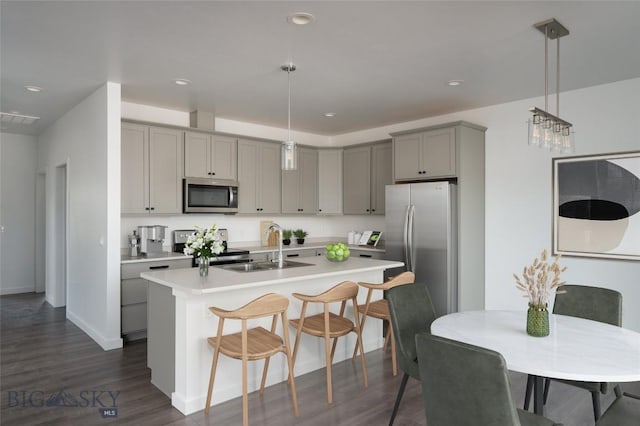 43 Old Yellowstone Trl, Three Forks, MT 59752 - kitchen with stainless steel appliances, gray cabinets, an island with sink, light countertops, and recessed lighting