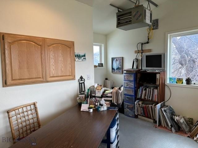 home office featuring plenty of natural light and a heating unit