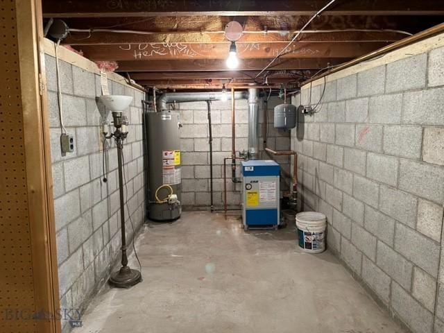 utility room with water heater and a heating unit