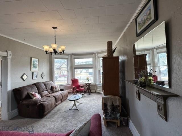 living room featuring baseboards, a textured wall, an inviting chandelier, crown molding, and carpet flooring