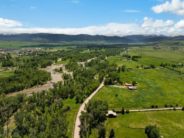 birds eye view of property featuring a mountain view and a rural view