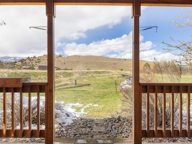 view of yard featuring a rural view and a mountain view