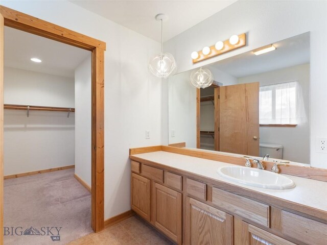 bathroom with vanity and toilet