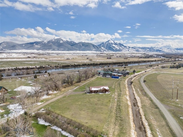 drone / aerial view featuring a mountain view and a rural view