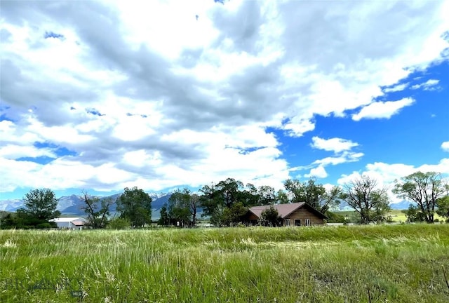 view of landscape featuring a mountain view and a rural view